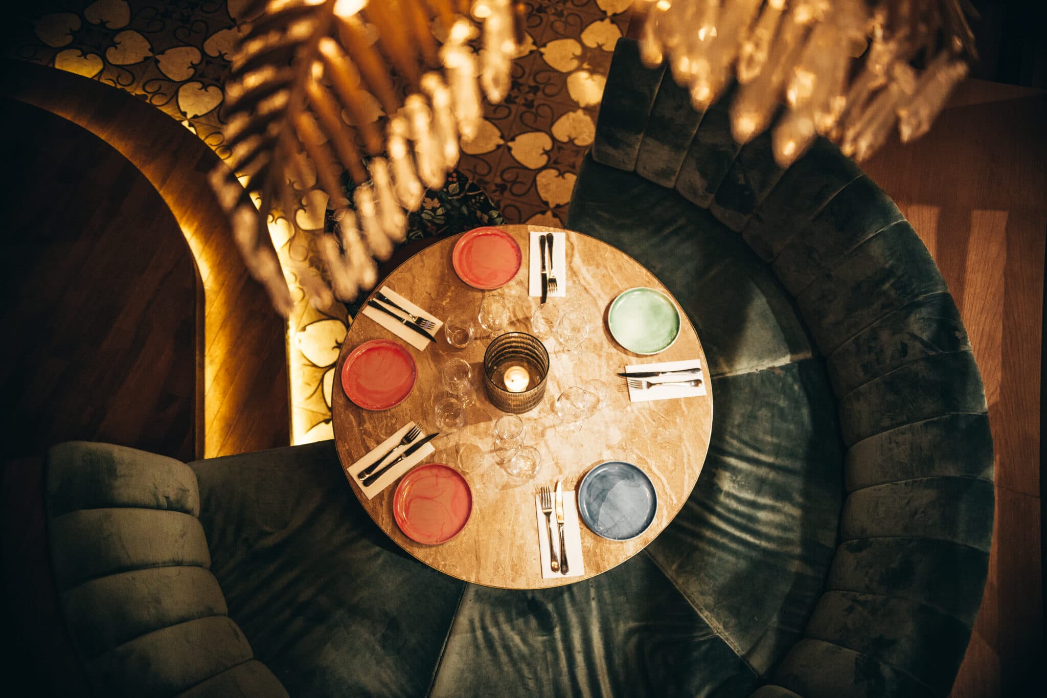 A set table seen from above, warm light